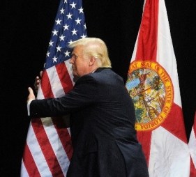 Trump hugging flag detail